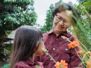A woman and child gardening